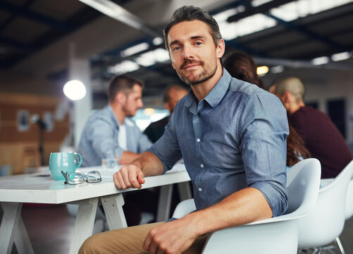 Portrait, leader and business man at meeting for coworking opportunity, pride or experience. Face, professional entrepreneur or project manager working with creative team planning at startup office