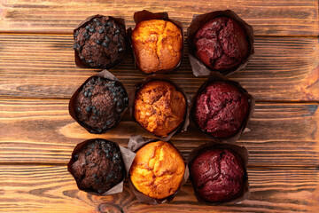 Mix of muffins ( cupcake ) chocolate , vanilla , berries . Top view