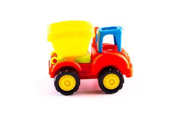 Dump truck toy isolated on white background. Construction industrial equipment for transporting materials