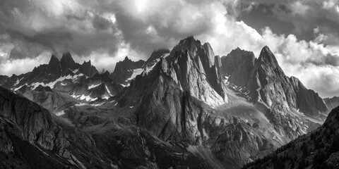 A majestic mountain range captured in black and white photography, suitable for use in editorial or commercial projects