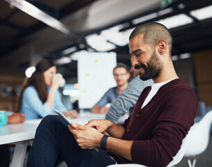 Fototapeta premium Creative, relax and man in meeting with tablet for schedule, agenda or connectivity for workshop. Scroll, research and happy business people in conference room on digital app for project management