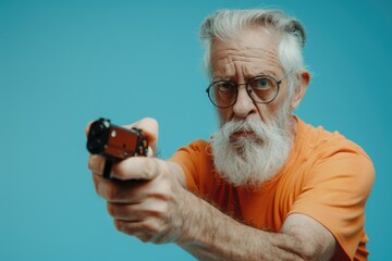 A man with a beard and glasses is depicted holding a gun, conveying a sense of caution or protection