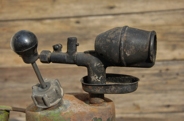old gasoline blowtorch close up. selective focus