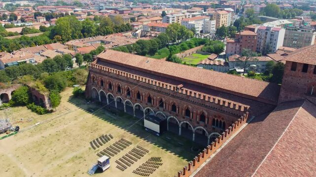 Italian castle an artistic historical cultural heritage. Visconti castle of Pavia with its walls, bridge, moat, towers. Structure that attracts tourists traveling to discover the wonders of Italy.