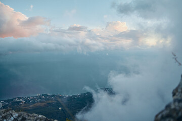 Majestic Ocean View from Mountain Summit with Person Standing on Cliff Edge A Serene Traveler's Bliss