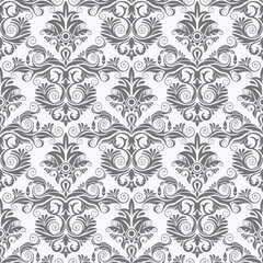 A decorative gray and white pattern featuring intricate swirls and floral motifs, ideal for backgrounds or textiles.
