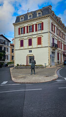 Statue in front of the corner building