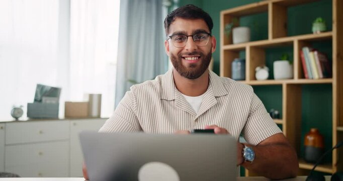 Face, phone and man in home office networking on social media, mobile app or internet. Laptop, technology and male freelance copywriter on break for remote work with smartphone, funny joke and meme