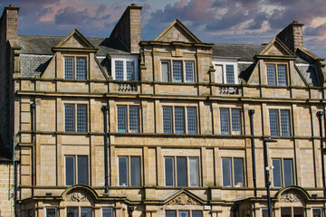Fototapeta premium Historic Stone Building Facade with Dramatic Sky in Harrogate, UK