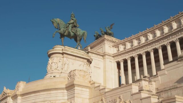 Monument to Victor Emmanuel II, a stunning equestrian statue stands proud against the blue sky, capturing Rome's historic beauty