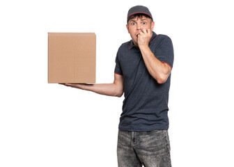 A shocked delivery man holding a cardboard box in one hand, biting his nails. Isolated on a white...