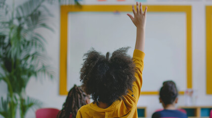 Student raising hand in a classroom to ask a question during a lesson on a sunny day