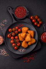 Breaded camembert or brie cheese baked in the form of nuggets with salt and spices