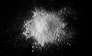 White powder pile isolated on black, clipping path