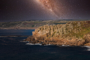 Starry Night Over Rugged Cliffs at Land's End in Cornwall, UK