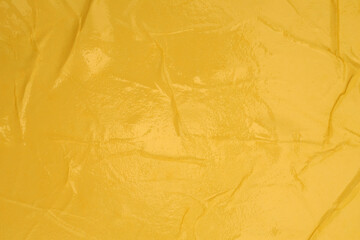 Empty crumpled crack wet beige Yellow paper blank texture copy space wall background.