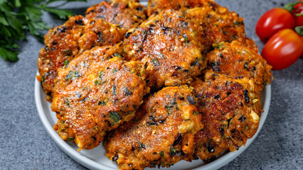 Tasty and crispy eggplant patties on a plate close up. Healthy vegetarian food