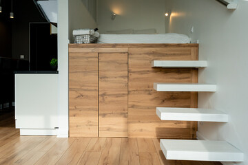A beautifully designed Modern Minimalist Bedroom featuring an Elevated Bed complemented by Stylish...