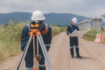 Surveyor engineer worker making measuring with theodolite tool equipment at construction site....