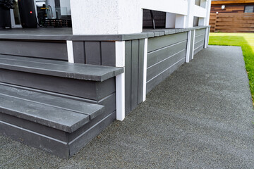 The stairs are constructed with wood, displaying a gray and white color scheme