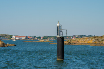 Solar powered navigational light on a pole.