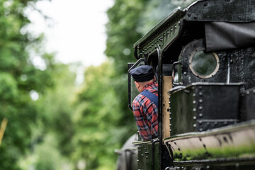 Vintage museum steam locomotive driver.
