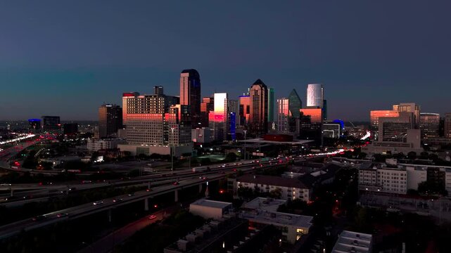 Dallas skyline and highway traffic at night / dusk