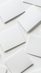 Six Blank White Rectangular Postcards Lying Spread Out on a Flat Surface