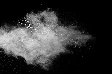 White powder explosion on black background. Colored cloud. Colorful dust explode. Paint Holi.
