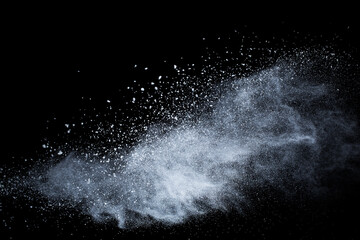 White powder explosion on black background. Colored cloud. Colorful dust explode. Paint Holi.