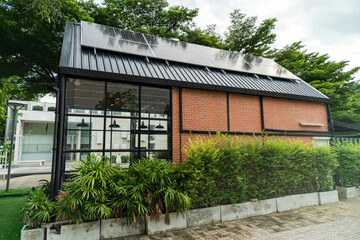 Fototapeta premium Modern building using solar panels for renewable energy