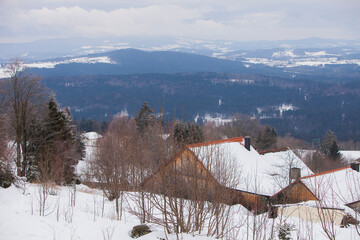 Overview on Bayerischer Wald and some houses on the foreground.