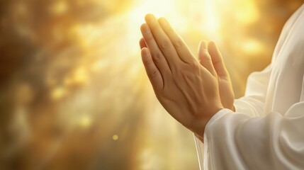 Person praying with folded hands against a warm, glowing background, expressing faith and hope in a serene moment of worship and connection with the divine