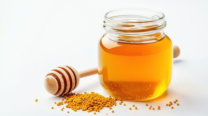   A jar of honey next to a wooden honey dipper on a white background