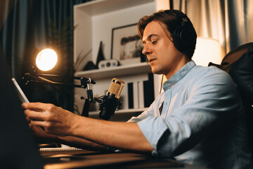 Host channel in smart broadcaster promote fanclub page on social media with share, post, like and comment on streaming record to follow live time up to date at modern studio in warm light. Pecuniary.