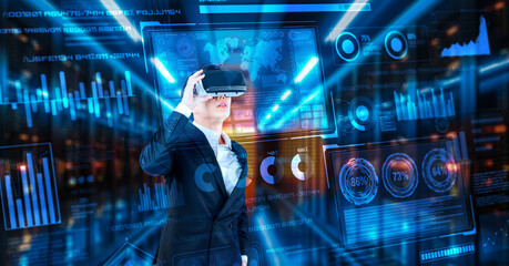 Businessman with headset standing at data center while analyzing financial data. Manager looking marketing statistic hologram and using augmented reality goggles while making a decision. Ingenuity.