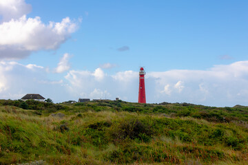 The red lighthouse north tower (Noordertoren) on the dune, Schiermonnikoog is a municipality and national park in the Northern Netherlands, One of the West Frisian Islands on the edge of the North Sea