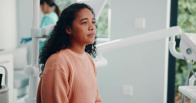 Woman, scared and anxiety at dentist for worry, healthcare and dental health with medical procedure. Orthodontics, doctor and patient at clinic for consultation, oral care or teeth whitening service