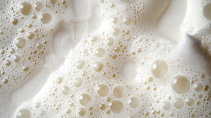 a close-up, top-down view of molecular gastronomy foam, filling the entire frame with the focus on the light, airy culinary foam
