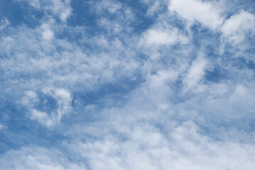 gentle white clouds in the blue sky