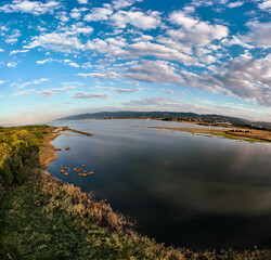 Stunning Aerial View of Lake and Forest on a Cloudy Day. Wide angle, selective focus.