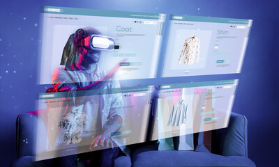 Caucasian man choosing and selecting product for shopping list while wearing visual reality goggles. Skilled person sitting at sofa with shopping bags while using VR glasses. Technology. Deviation.