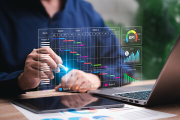 Project schedule and cost planning concept, Businessman analyze business data schedule before start work and plans long-term projects and cost plans, Makes KPI, profit, Target operations marketing