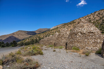 The Wildrose Charcoal Kilns in Death Valley, California, stand as a testament to the area's rich mining history, set against a striking desert and mountain backdrop.