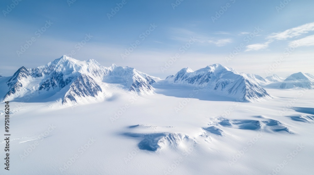 Wall mural snow-covered mountain peaks in a pristine arctic landscape