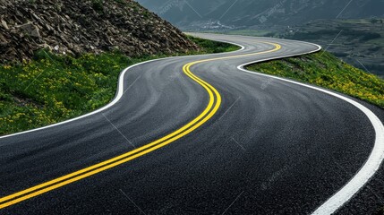 Winding Road Through Mountain Pass With Yellow Lines
