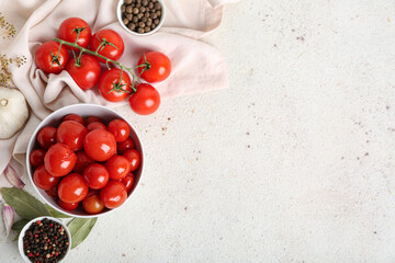 Bowl with canned tomatoes and peppercorn on white background