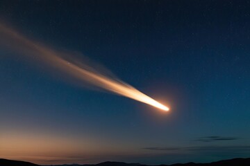 A vivid meteor with a flickering incandescent tail traversing the evening sky