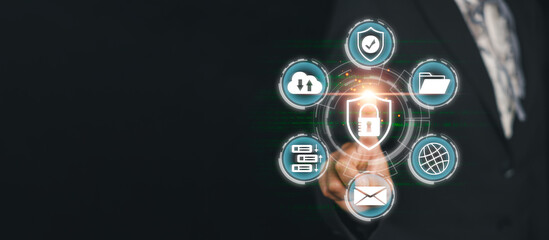 Businessman interacting with digital icons representing cybersecurity and privacy concepts on a...