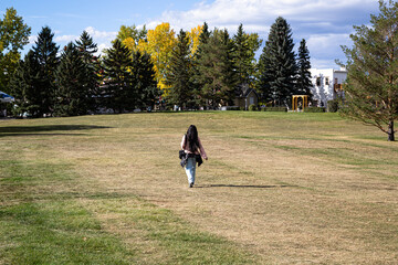 person walking in field